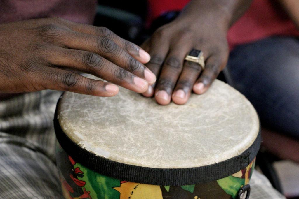 SMWC Master's student playing drum